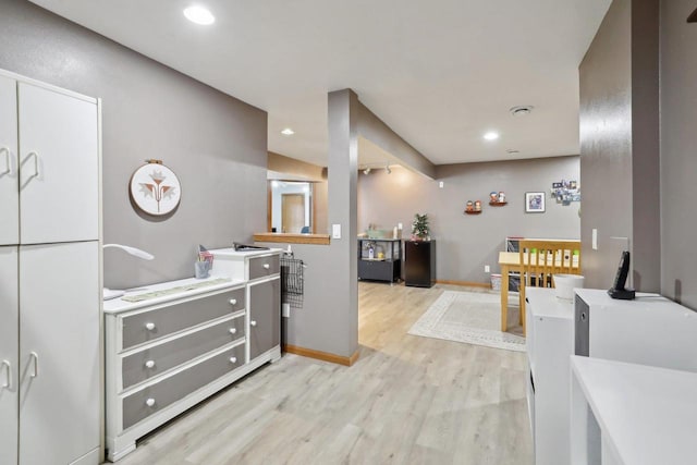 kitchen featuring light wood-type flooring, baseboards, and recessed lighting