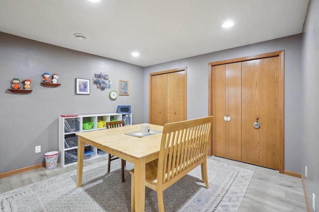 dining space featuring baseboards, recessed lighting, and light wood-style floors