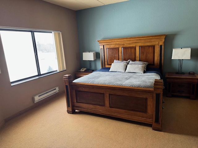 carpeted bedroom with a baseboard heating unit