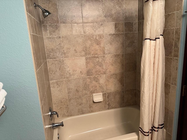 bathroom featuring shower / bathtub combination with curtain