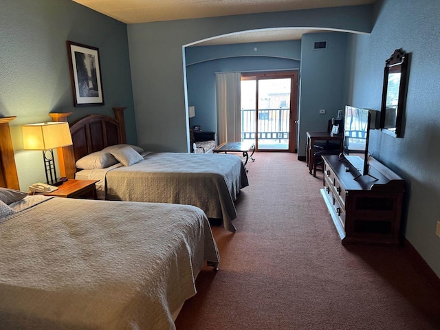 bedroom featuring carpet flooring and access to outside