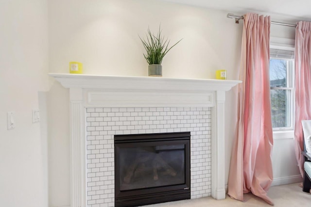 interior details featuring carpet flooring and a fireplace