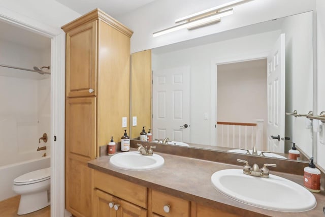 full bathroom with vanity, shower / tub combination, and toilet