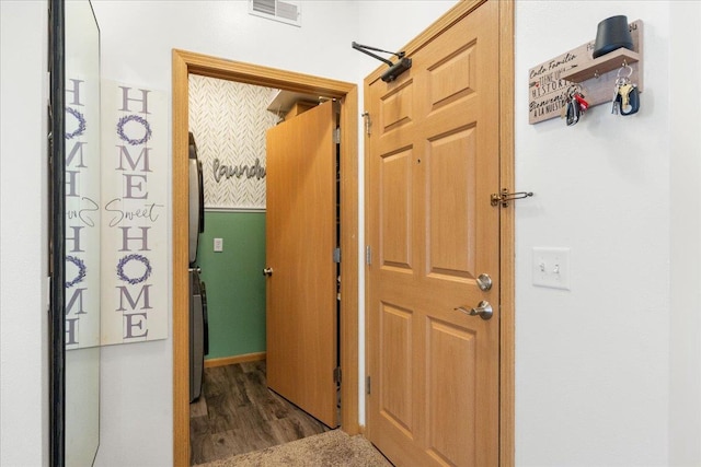 corridor featuring dark hardwood / wood-style flooring