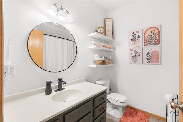 bathroom with vanity and toilet