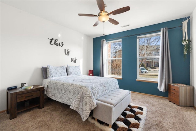 bedroom featuring ceiling fan and light colored carpet