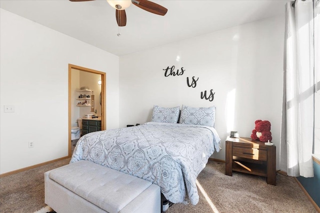 bedroom with ceiling fan, connected bathroom, and carpet floors