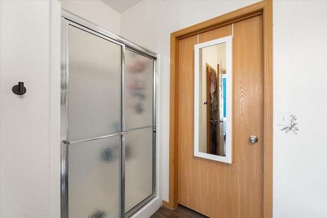 bathroom featuring an enclosed shower