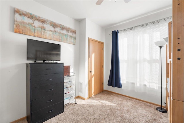 bedroom with ceiling fan and carpet floors