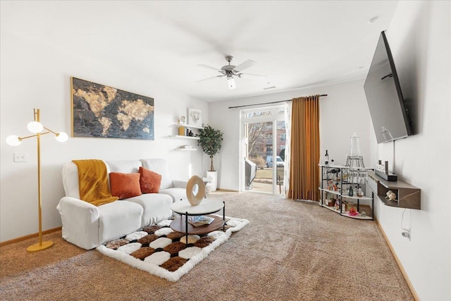 carpeted living room with ceiling fan