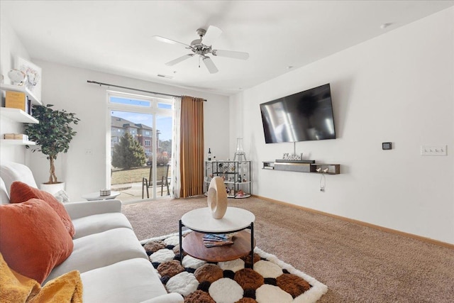 carpeted living room featuring ceiling fan