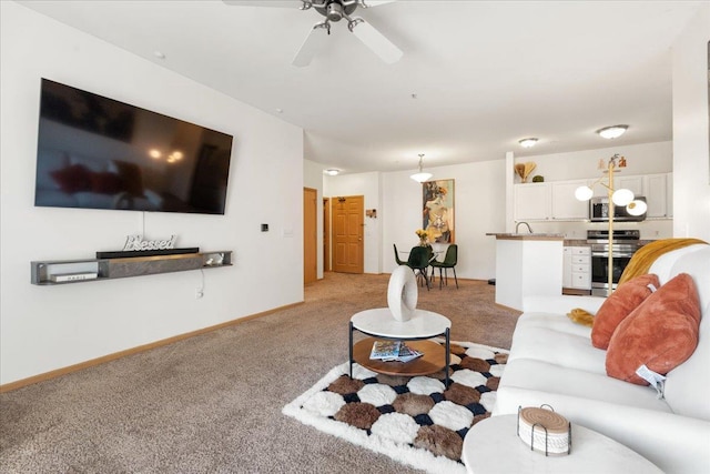 living room featuring light colored carpet and ceiling fan