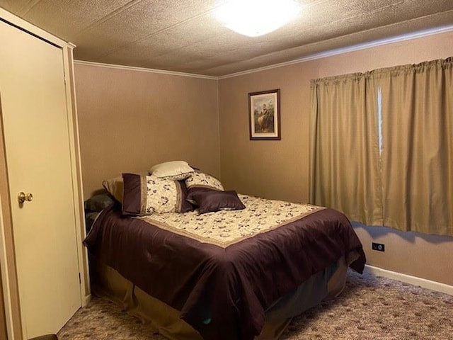 carpeted bedroom featuring ornamental molding