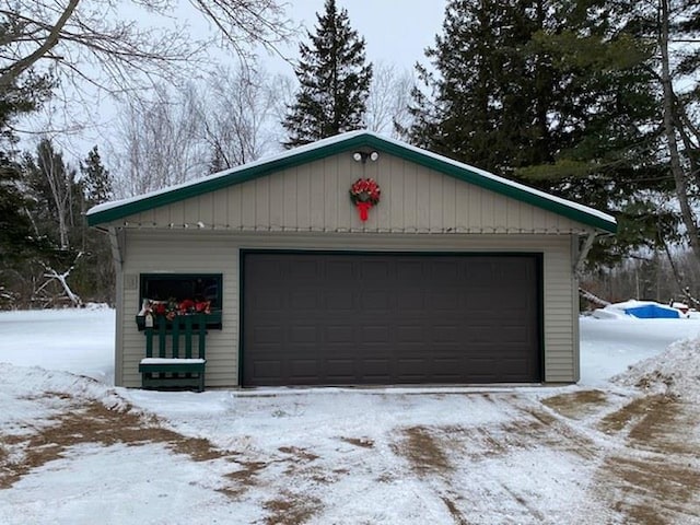 view of snow covered garage