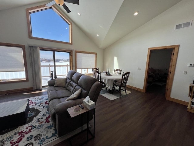 N8551 Lake Cabin Dr, New Lisbon, WI 53950 - living room with high vaulted ceiling, dark hardwood / wood-style floors, ceiling fan, and a water view