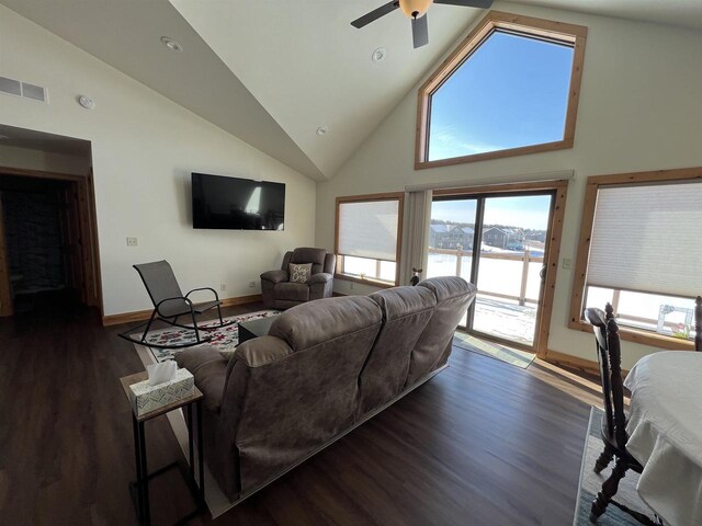N8551 Lake Cabin Dr, New Lisbon, WI 53950 - living room featuring ceiling fan, dark wood-type flooring, and high vaulted ceiling