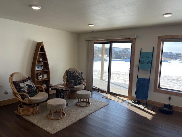 N8551 Lake Cabin Dr, New Lisbon, WI 53950 - living area with a water view, dark wood-type flooring, and a textured ceiling