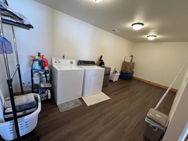 N8551 Lake Cabin Dr, New Lisbon, WI 53950 - clothes washing area featuring washer and clothes dryer and dark hardwood / wood-style floors