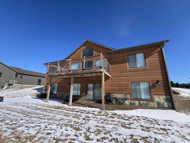 N8551 Lake Cabin Dr, New Lisbon, WI 53950 - snow covered back of property featuring a balcony
