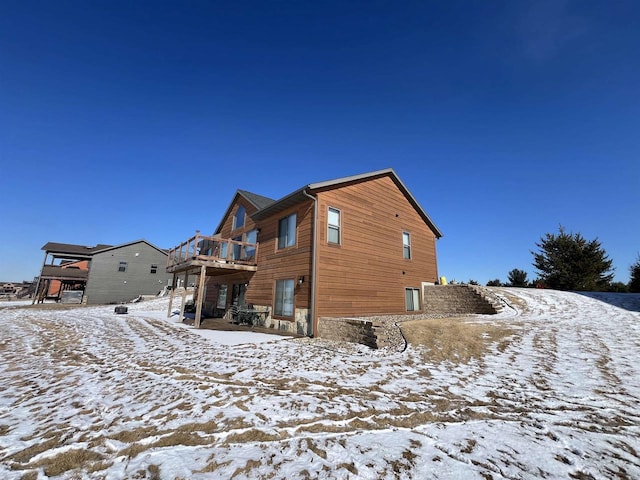 N8551 Lake Cabin Dr, New Lisbon, WI 53950 - snow covered rear of property featuring a deck