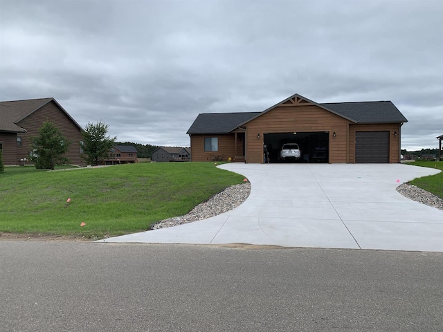 N8551 Lake Cabin Dr, New Lisbon, WI 53950 - view of front of property featuring a garage and a front yard