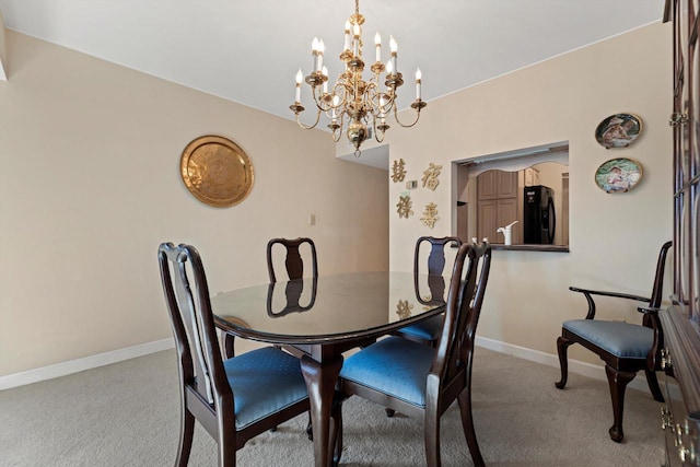 dining area featuring light colored carpet