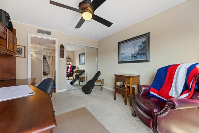 home office with light colored carpet and ceiling fan