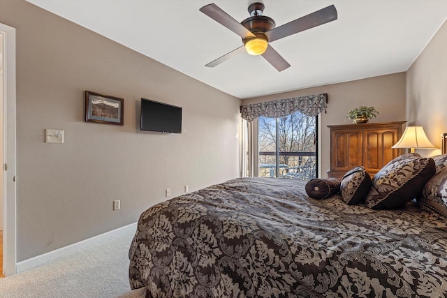 bedroom featuring ceiling fan and carpet