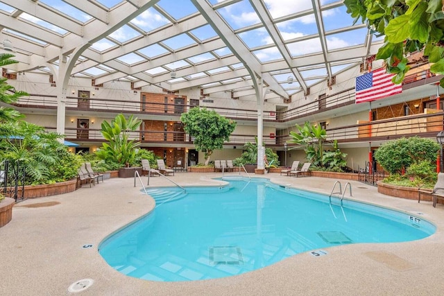 view of swimming pool with a patio