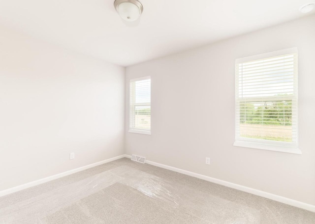 6542 Prairie Wood Dr, Mcfarland, WI 53558 - spare room with light colored carpet and baseboards