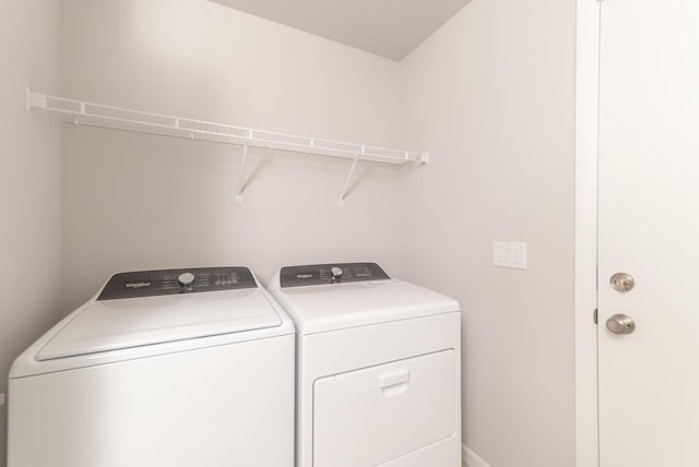 6542 Prairie Wood Dr, Mcfarland, WI 53558 - laundry room featuring washer and clothes dryer and baseboards
