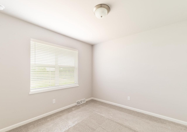 6542 Prairie Wood Dr, Mcfarland, WI 53558 - unfurnished room with baseboards and light colored carpet