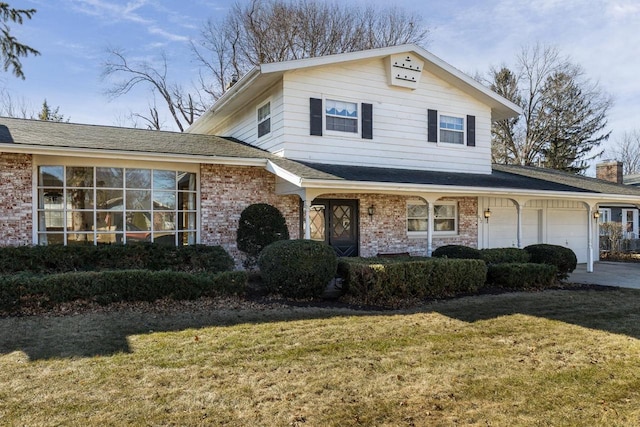 view of front of house featuring brick siding, an attached garage, a front lawn, and roof with shingles