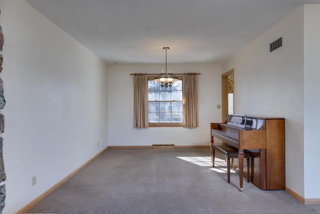 carpeted dining space featuring visible vents, a notable chandelier, and baseboards