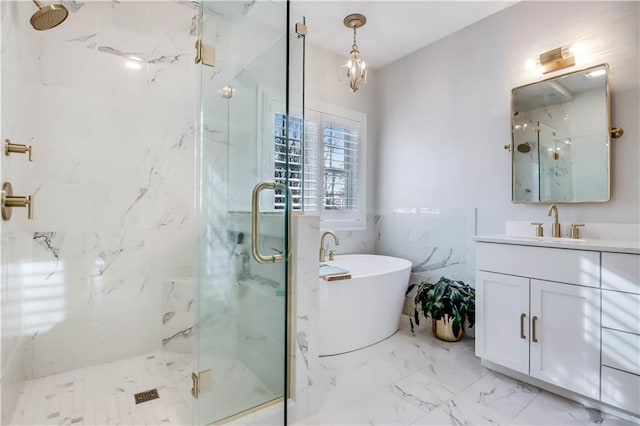 bathroom featuring shower with separate bathtub and vanity