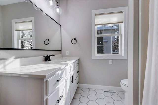 bathroom with vanity and toilet