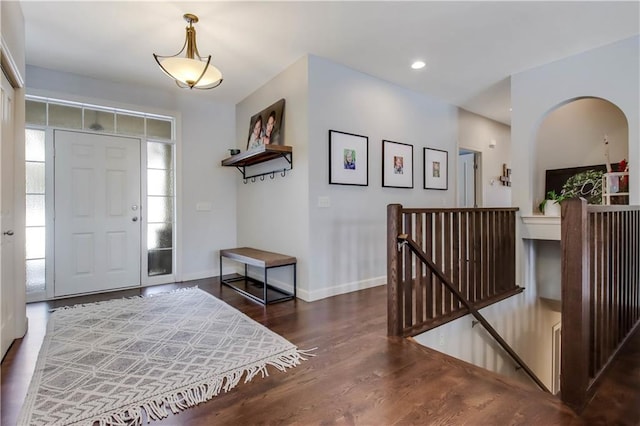 entrance foyer featuring dark hardwood / wood-style floors