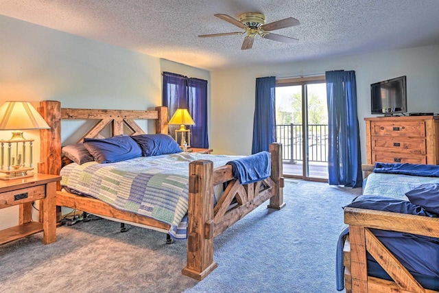 carpeted bedroom with access to outside, a textured ceiling, and ceiling fan