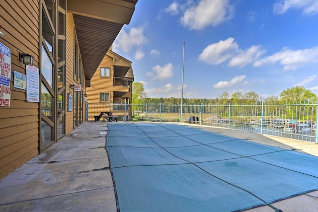 view of pool featuring a patio area