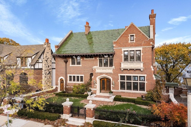 english style home with french doors