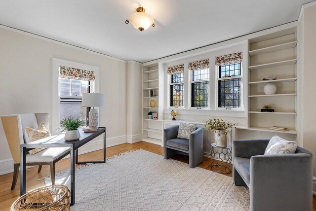 sitting room featuring light hardwood / wood-style flooring