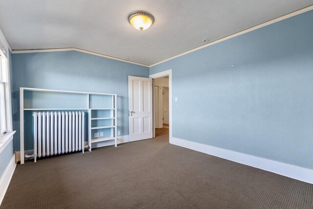 carpeted empty room featuring ornamental molding and radiator