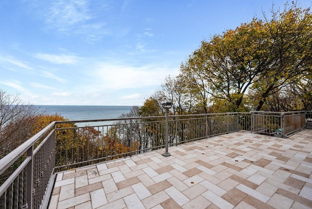 view of patio / terrace featuring a water view