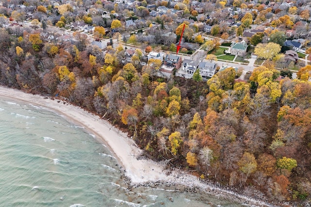 bird's eye view featuring a water view and a view of the beach