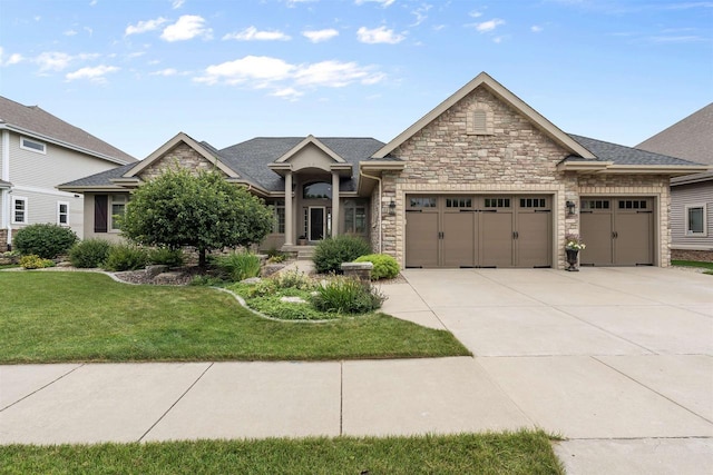 view of front of home with a garage and a front yard