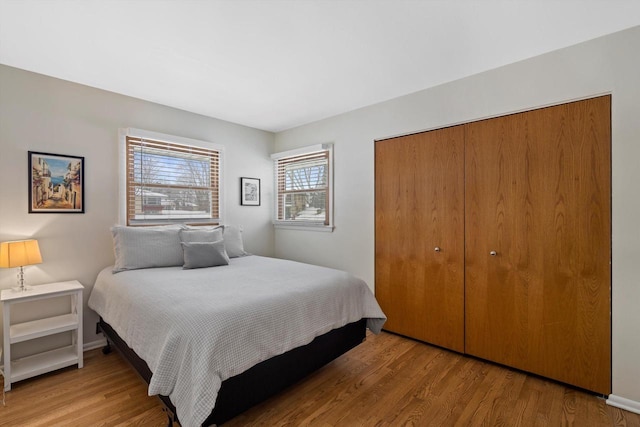 bedroom with a closet and light wood-type flooring