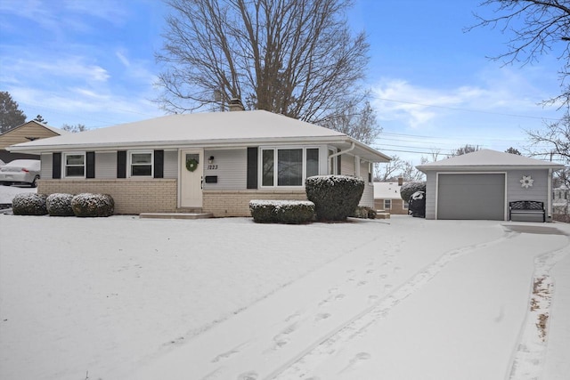 view of front of house featuring a garage and an outdoor structure