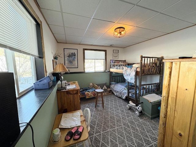 bedroom featuring a paneled ceiling