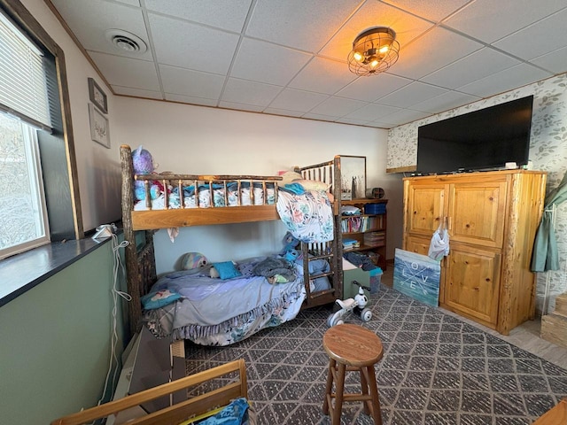 bedroom with a paneled ceiling