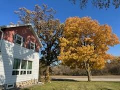 view of side of property featuring a yard